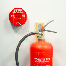 fire extinguisher theft stopper shown attached in situ with a red fire extinguisher against a white background