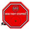 Red octagonal St6255 Mini Theft Stopper Front with white text and a small black strap attached