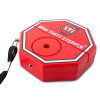 Angled view of a red STI mini theft stoppers device with a black wrist strap attached