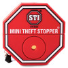Front view of a red sti mini theft stopper device with white and black detailing and a central circular feature