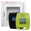 A green ZOLL AED Plus fully automatic defibrillator and a black ZOLL AED case placed in front of a white emergency defibrillator cabinet labelled “Emergency Defibrillator” with an alarm warning on the lower left corner.