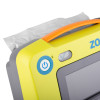 Closeup of a power button on the zoll aed 3 defibrillator full automatic with a yellow casing and orange handle