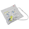 Flat angled view of zoll aed plus cprd padz in sealed packaging with visible instructions and connector cable