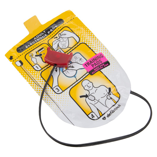 defibtech lifeline aed adult training pads shown at an angled view with visible instructions and red connector clip
