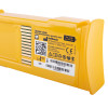Closeup of a defibtech lifeline aed auto high capacity battery showing the yellow casing and label with product details