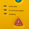 Closeup of indicators and shock button on defibtech lifeline semi automatic defibrillator 5 year battery