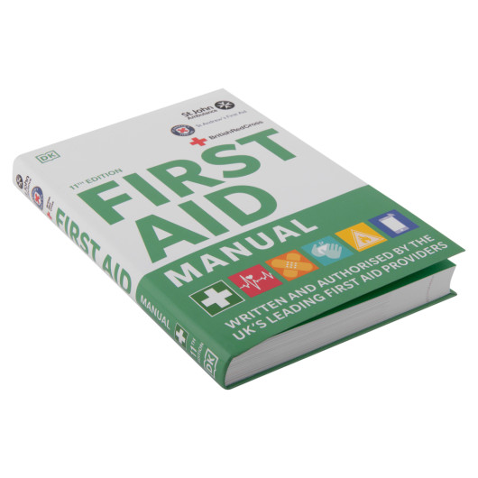 Angled photo of the st john ambulance first aid manual with green and white cover and various icons on the front