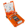 Open AED training device showing electrode pads, wiring, and illustrated instructions inside the lid for pad placement.