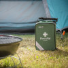 St John Home first aid kit standing on grass outside a tent with a barbecue grill nearby