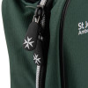 Close-up of the zip pull tabs on the green fabric of the st john home kit bag with white logo visible