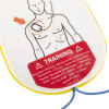 Close up of a training warning label on philips heartstart hs1 adult training pads showing a diagram of pad placement on a torso
