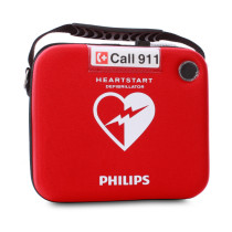 Front view of the heartstart hs1 slim carry case in red with a handle and emergency call 911 label