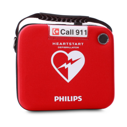 Front view of the heartstart hs1 slim carry case in red with a handle and emergency call 911 label