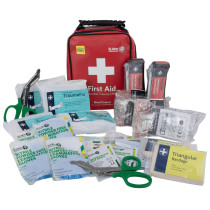 tourniquet kit contents including gloves, bandages, scissors, and other first aid items displayed with a red bag