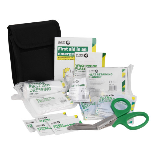 St john personal issue kit showing contents including scissors, dressings, plasters, gloves and a heat retaining blanket