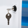 Key inserted in lock of st john ambulance first aid cabinet with key showing part of white cabinet and blue interior shelves