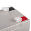 Close-up detail of Su12V7Ab 12Vdc 1Ah Battery terminals showing red and black markings with clear plastic covers