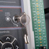 Key inserted into the lock of the rafiki twinflex pro 2 fire alarm panel 2 zone showing the control keys