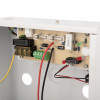Closeup of the internal circuit board and wiring of a 12v 1 amp power supply unit with backup battery