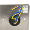 Closeup of the back of an access control green dome exit button showing yellow and blue wires attached to a metal plate
