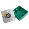 Inside view of access control green dome exit button showing green plastic base and metal plate with attached wires