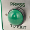 Green dome button from access control green dome exit with the words press to exit on a metal plate