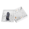 inside view of an access control white exit button showing internal components and mounting parts