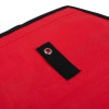 Close-up of red document pouch showing black hanging hole with metal ring and black edging