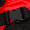 Close-up of a black plastic buckle on the emergency evacuation sheet showing strap and clasp detail