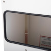 Close-up of the slot extinguisher inside the mailsafe commercial mailbox showing the black rubber edge and white interior