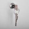 Keys hanging from the lock of the mailsafe commercial mailbox shown in the image