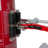 Close up of ultrafire extinguisher servicing clamp attached to a red extinguisher with red handles and black rollers
