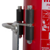ultrafire extinguisher servicing clamp gripping the side of a red canister with instructions label visible