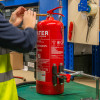 Close up of the releasing handle on an ultrafire extinguisher servicing clamp