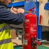 ultrafire extinguisher servicing clamp showing a close-up of the tightening head being adjusted