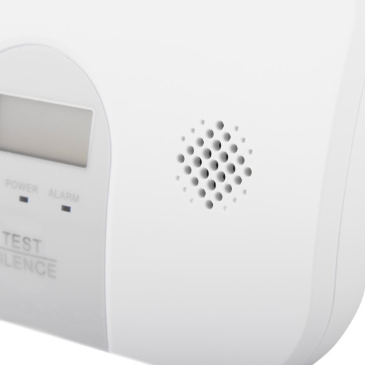 Closeup of the sounder on the ultrafire 10yr digital carbon monoxide alarm showing speaker holes and part of the display panel