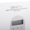 Closeup of ultrafire 10yr digital carbon monoxide alarm showing text and a small display screen