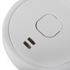 Closeup of the sounder section on an ultrafire battery optical smoke alarm showing the test button and vents