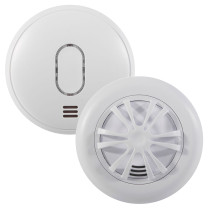 Two round white Ultrafire alarms, one smoke alarm with a smooth front and oval LED indicator, and one heat alarm featuring a vented radial heat‑sensing grid. Both units have small grille openings for sound output.