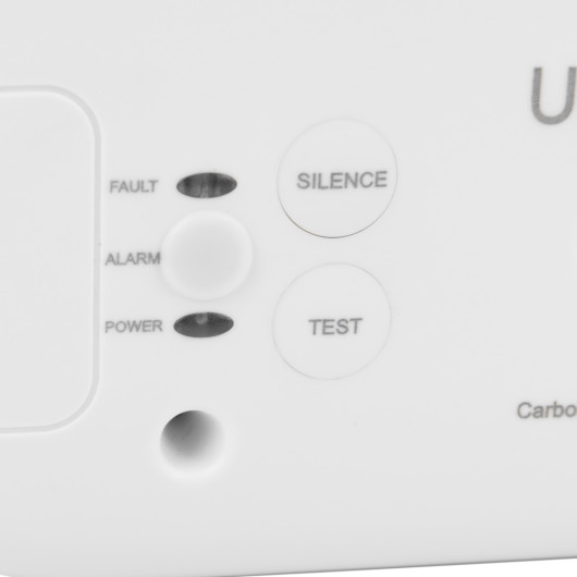 Close up of button and LED labels on sealed 10 year carbon monoxide detector showing silence and test buttons with fault alarm and power indicators
