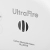 Close-up of sounder on a sealed 10 year carbon monoxide detector showing part of the logo and alarm vents