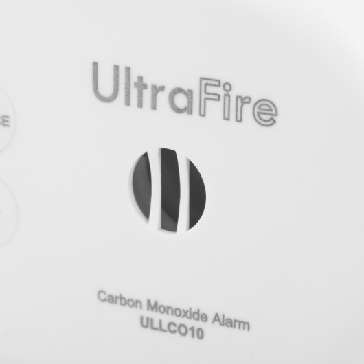 Close-up of sounder on a sealed 10 year carbon monoxide detector showing part of the logo and alarm vents