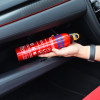 Hand placing ultrafire 600g powder extinguisher inside a glovebox of a car