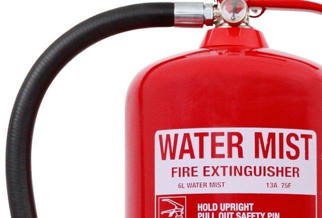 Water mist extinguisher in use
