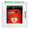White emergency defibrillator cabinet holding an orange IPAD AED bag labelled “Intelligent Public Access Defibrillator.”