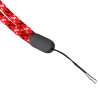 Closeup of Wriststrap Rs wrist strap showing red, black, and white spots with a black plastic attachment and loop