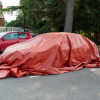 bridgehill single use car fire blanket covering a car parked on the side of the road