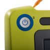 A close-up of the blue power button on a bright green defibrillator