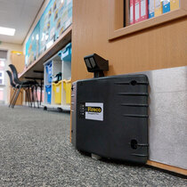 Dorgard Pro holds fire doors open at any angle safely and legally, designed to be foot-operated for hands-free use