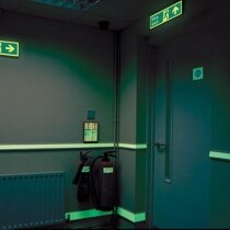 Photoluminescent Water-Based Paint System highlighting fire exits and signs in the dark